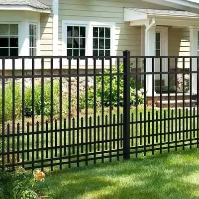 Black flat-top aluminum fence with the puppy picket attachment: short, closely spaced pickets along the bottom